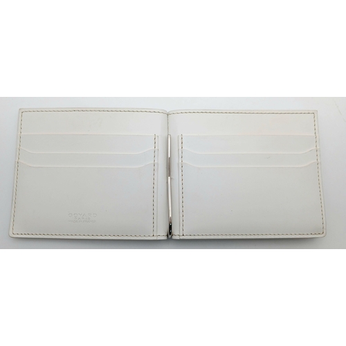 221 - A Goyard Victoire White Wallet. White canvas exterior with Goyardine monogram pattern and silver-ton... 