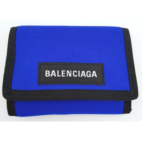 242 - A Balenciaga Nylon Trifold Wallet. Blue and black textile exterior with a velcro closure. Black text... 