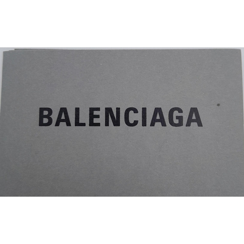 242 - A Balenciaga Nylon Trifold Wallet. Blue and black textile exterior with a velcro closure. Black text... 