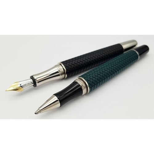 256 - A Wonderful Chopard Pen Set: Chopard palladium plated roller pen and a black lacquer fountain pen wi... 