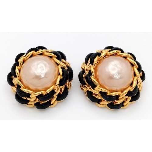 263 - A Pair of Designer Chanel Clip On Earrings. Central faux pearl  with Gold plate and leather trim on ... 