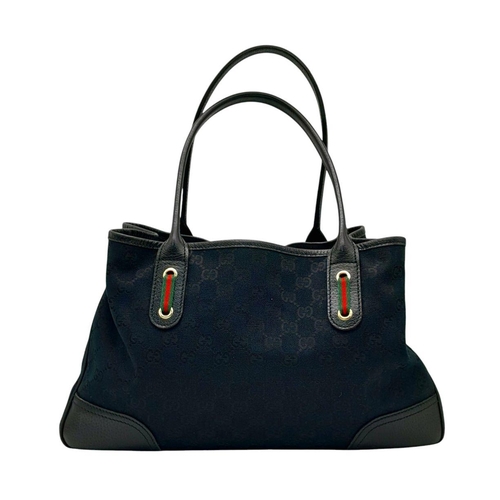 347 - A Gucci Black Suede and Leather Tote Bag. Suede and leather exterior with gold-toned hardware, prote... 