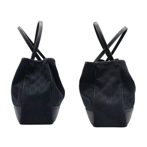 347 - A Gucci Black Suede and Leather Tote Bag. Suede and leather exterior with gold-toned hardware, prote... 