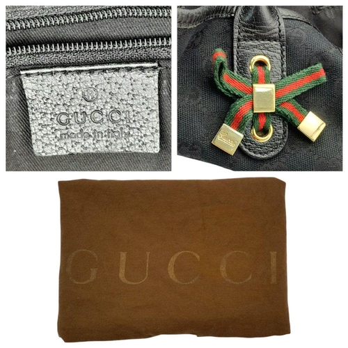 347 - A Gucci Black Suede and Leather Tote Bag. Suede and leather exterior with gold-toned hardware, prote... 