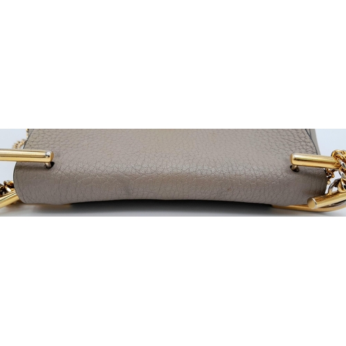 381 - A Chloe Taupe Leather Drew Shoulder Bag. Pebbled taupe leather exterior with gold-toned hardware, a ... 