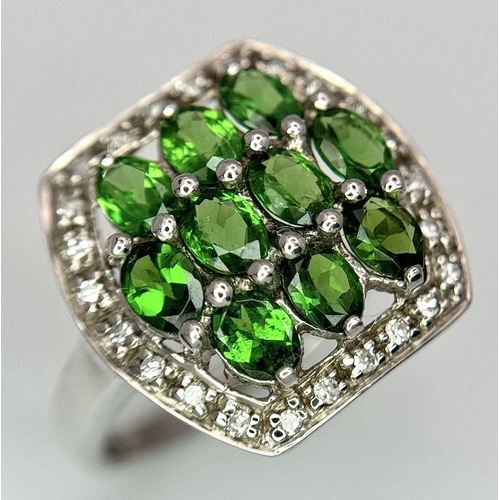 403 - A 9K White Gold Green and White Stone Signet Ring. Size N 1/2. 2.95g total weight.  Ref: STK019951