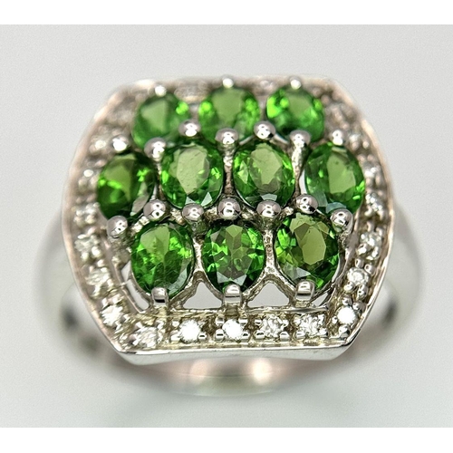 403 - A 9K White Gold Green and White Stone Signet Ring. Size N 1/2. 2.95g total weight.  Ref: STK019951