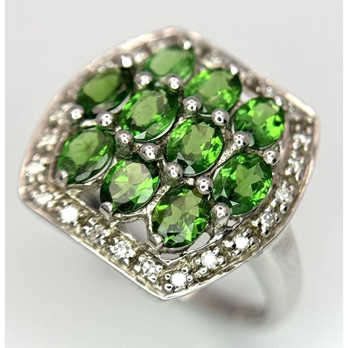 403 - A 9K White Gold Green and White Stone Signet Ring. Size N 1/2. 2.95g total weight.  Ref: STK019951