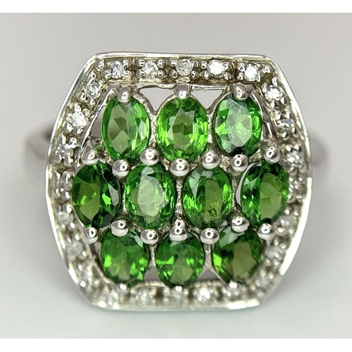 403 - A 9K White Gold Green and White Stone Signet Ring. Size N 1/2. 2.95g total weight.  Ref: STK019951