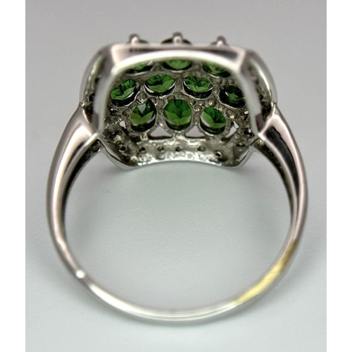 403 - A 9K White Gold Green and White Stone Signet Ring. Size N 1/2. 2.95g total weight.  Ref: STK019951