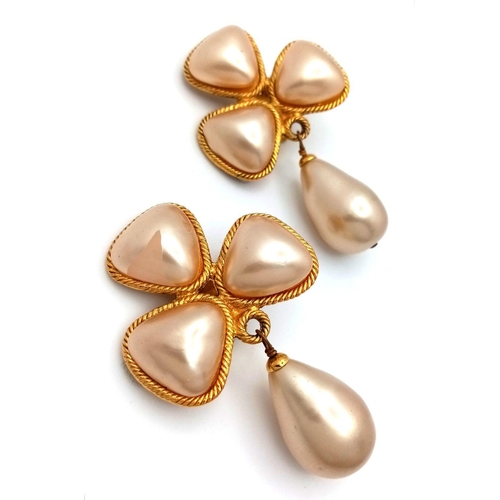 592 - A Pair of Designer Chanel Dress Clip-On Drop Earrings. Faux pearl with gilded scroll borders. 6cm. C... 