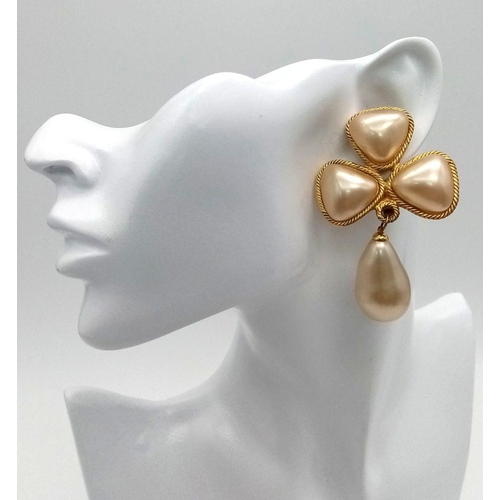 592 - A Pair of Designer Chanel Dress Clip-On Drop Earrings. Faux pearl with gilded scroll borders. 6cm. C... 