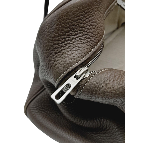 60 - A Hermes Taurillon Clemence Victoria II 35 Handbag. Etoupe leather exterior with silver toned hardwa... 