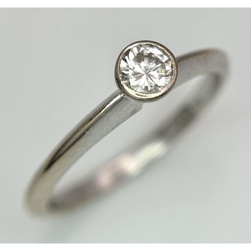 688 - An 18K white gold ring set with a brilliant cut solitaire diamond - 0.25ct. Size O. 2.8g total weigh... 