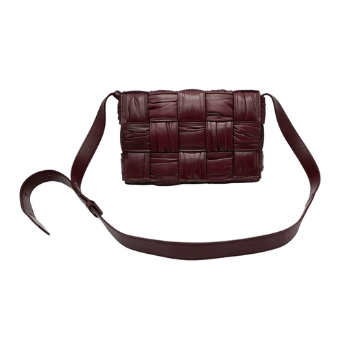 95 - A Bottega Veneta Calfskin Intreccio Plisse Cassette Crossbody Bag. Burgundy woven leather exterior, ... 