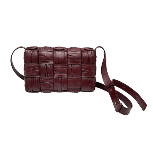 95 - A Bottega Veneta Calfskin Intreccio Plisse Cassette Crossbody Bag. Burgundy woven leather exterior, ... 