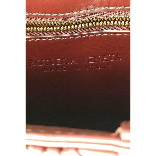 95 - A Bottega Veneta Calfskin Intreccio Plisse Cassette Crossbody Bag. Burgundy woven leather exterior, ... 