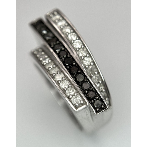 146 - A 9K WHITE GOLD BLACK & WHITE DIAMOND 3 ROW FANCY RING 0.50CT 5.9G SIZE N. Ref: SC 7036