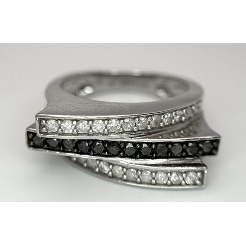 146 - A 9K WHITE GOLD BLACK & WHITE DIAMOND 3 ROW FANCY RING 0.50CT 5.9G SIZE N. Ref: SC 7036