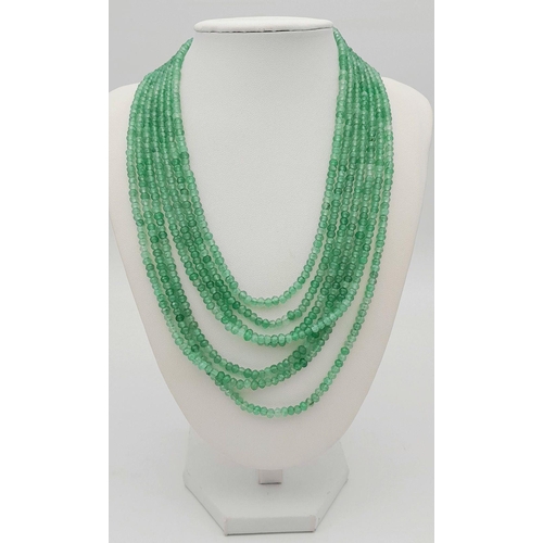 1578 - A seven-row emerald bead necklace. Approx 49cm in length, total weight: 89g