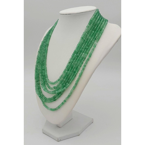 1578 - A seven-row emerald bead necklace. Approx 49cm in length, total weight: 89g