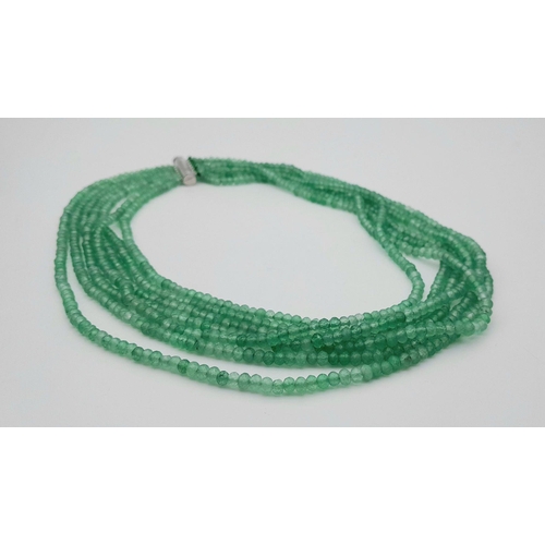 1578 - A seven-row emerald bead necklace. Approx 49cm in length, total weight: 89g