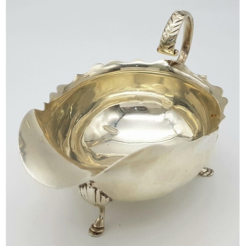 1655 - An Antique Sterling Silver Gravy Boat. Hallmarks for Birmingham 1907. 16cm length. 9cm tall. 139g.