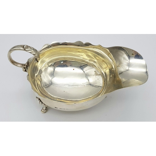 1655 - An Antique Sterling Silver Gravy Boat. Hallmarks for Birmingham 1907. 16cm length. 9cm tall. 139g.