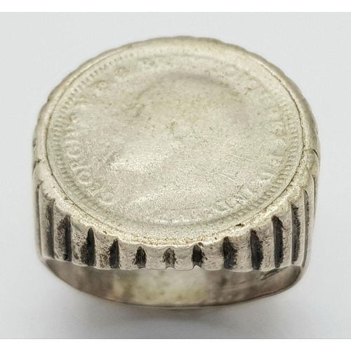 1657 - A vintage silver coin signet ring. Total weight 4.7G. Size K.