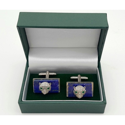 1710 - A pair of lapis panther cufflinks. Total weight: 20.7g. Comes with a presentation box.