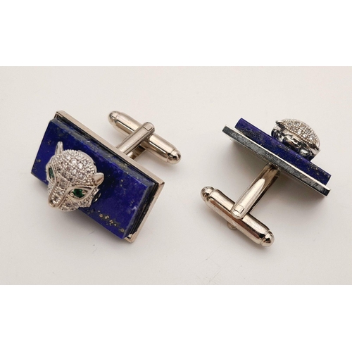 1710 - A pair of lapis panther cufflinks. Total weight: 20.7g. Comes with a presentation box.