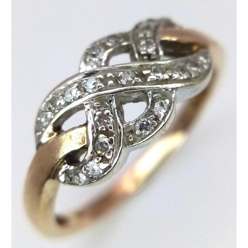 174 - A 9K YELLOW GOLD CELTIC KNOT DIAMOND SET RING - 2.6G. SIZE P.