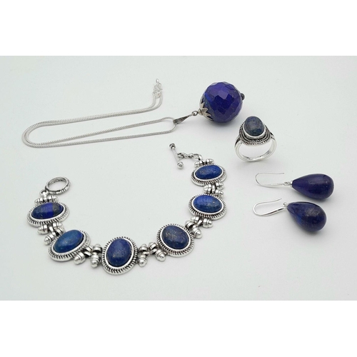 1775 - A set of Lapis Lazuli jewellery, including stone set ring (size S), a pair of 925 silver earrings, a... 