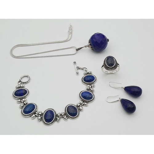 1775 - A set of Lapis Lazuli jewellery, including stone set ring (size S), a pair of 925 silver earrings, a... 