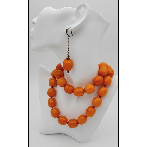 1782 - A matching yellow resin bead necklace and drop earrings suite. The necklace measures approximately 7... 