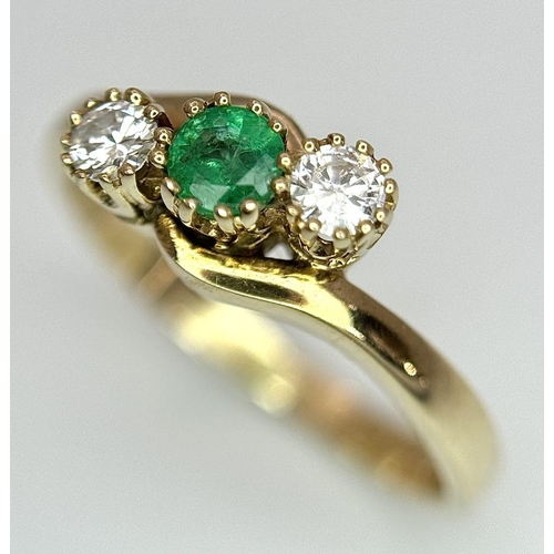 265 - A 9K YELLOW GOLD DIAMOND & EMERALD 3 STONE TWIST RING 0.15CT 2.7G SIZE M. Ref: SC 7037