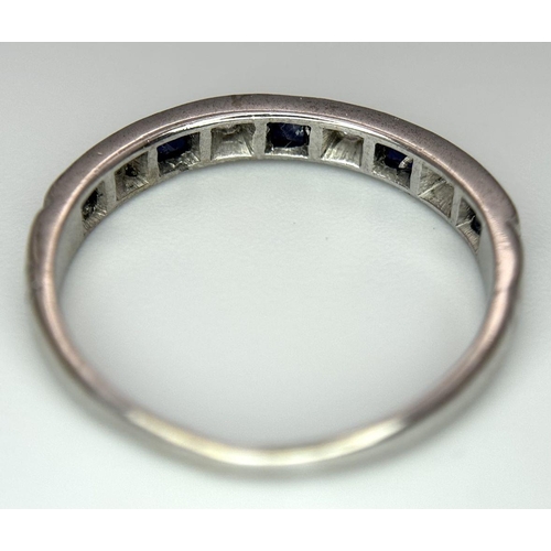 377 - A 18K WHITE GOLD DIAMOND & SAPPHIRE HALF ETERNITY RING 2.2G SIZE N 1/2. Ref: SC 7053