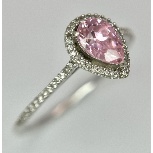 559 - A 9K WHITE GOLD DIAMOND & PINK TOPAZ RING 0.12CT D & 1.44CT PEAR SHAPE PINK TOPAZ 2.2G TOTAL WEIGHT,... 