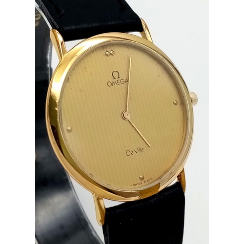 64 - A Vintage Omega Deville Thin Gents Quartz Watch. Black leather strap. Gilded case - 34mm. Gilded dia... 