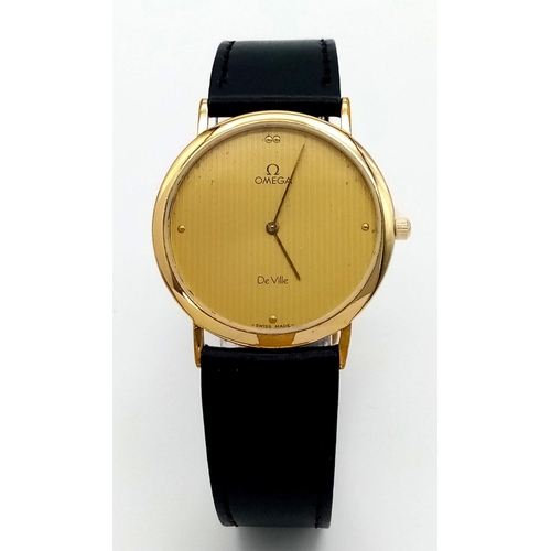 64 - A Vintage Omega Deville Thin Gents Quartz Watch. Black leather strap. Gilded case - 34mm. Gilded dia... 