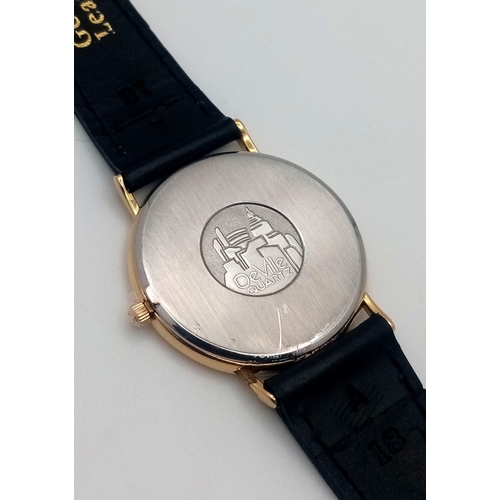 64 - A Vintage Omega Deville Thin Gents Quartz Watch. Black leather strap. Gilded case - 34mm. Gilded dia... 