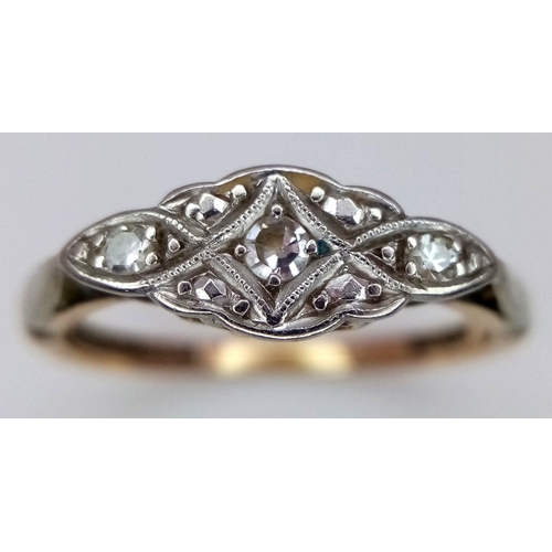 692 - A 9K YELLOW GOLD AND PLATINUM VINTAGE DIAMOND RING. 2.2G. SIZE O.