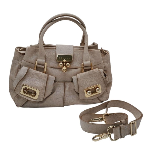 1125 - A Celine Brown Leather Shoulder Bag. Gold tone hardware. Twin exterior pockets. Two large clip open ... 