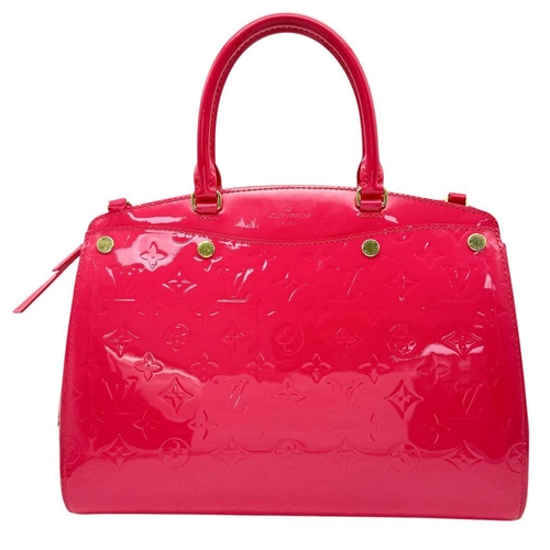 886 - A Louis Vuitton Vernis Brea NM Bag. Pink leather monogram exterior with gold-toned hardware, double ... 