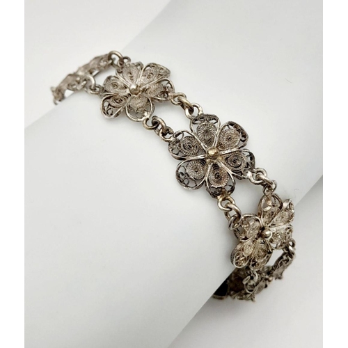 1956 - A Vintage Silver Filigree Flower Design Bracelet. 19cm Length. 1.4cm Width. Gross Weight 11.13 Grams... 