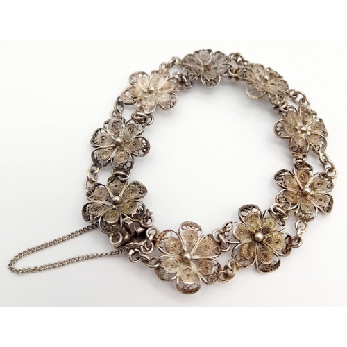 1956 - A Vintage Silver Filigree Flower Design Bracelet. 19cm Length. 1.4cm Width. Gross Weight 11.13 Grams... 