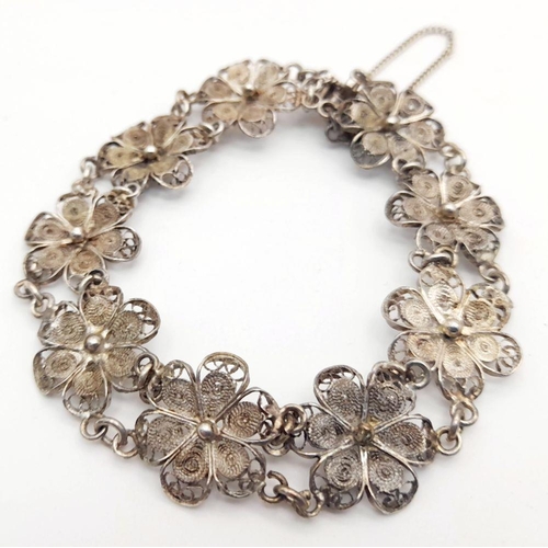 1956 - A Vintage Silver Filigree Flower Design Bracelet. 19cm Length. 1.4cm Width. Gross Weight 11.13 Grams... 