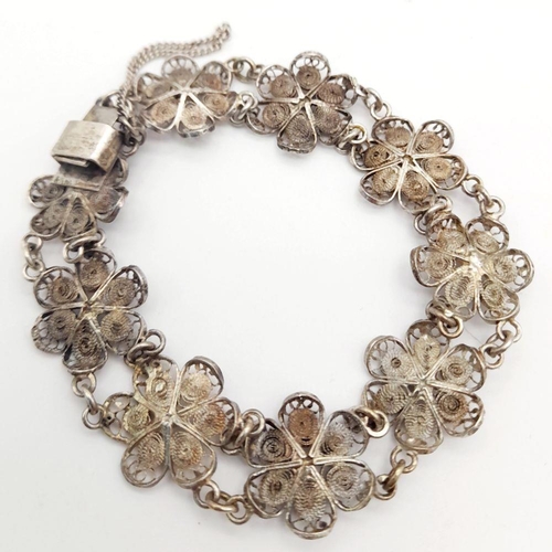 1956 - A Vintage Silver Filigree Flower Design Bracelet. 19cm Length. 1.4cm Width. Gross Weight 11.13 Grams... 