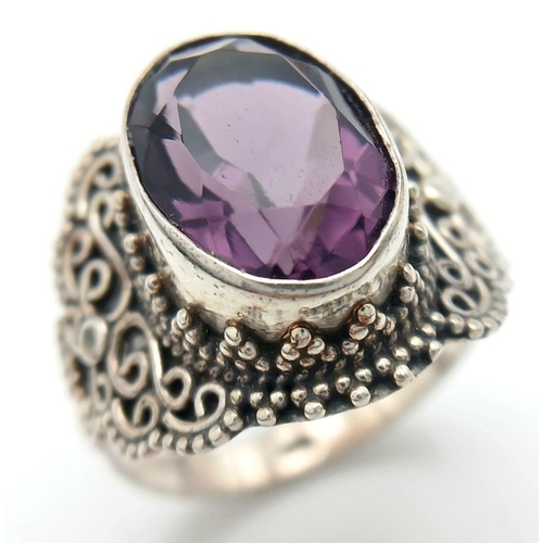 1722 - A Vintage Sterling Silver Amethyst Set Filigree Design Ring Size S. Set with a 1.4cm Length Top Colo... 