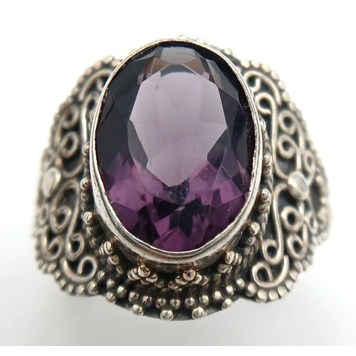 1722 - A Vintage Sterling Silver Amethyst Set Filigree Design Ring Size S. Set with a 1.4cm Length Top Colo... 